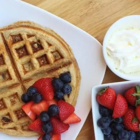 Protein waffles with berries and cream is a great way to refuel with proteins and carbs. Throw in some BCAAs and I'm on the road to my next workout. Vanilla Banana Protein Waffle recipe with Whey Protein Powder. #proteinpowder #proteinrecipe #recipe #waffles #breakfast