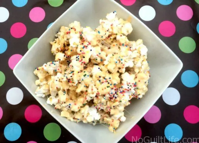 This is perfect for your next get together or summer snack: Birthday Cake Popcorn. Sweet and gooey goodness, with extra fiber as a bonus! It's like a rice krispy treat made with popcorn.
