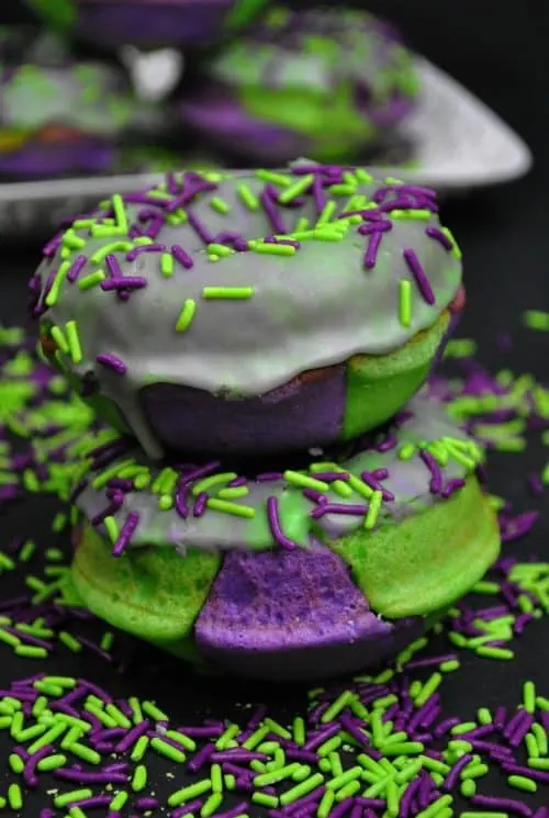 Marvel Incredible Hulk cake donuts on a plate with green and purple sprinkles