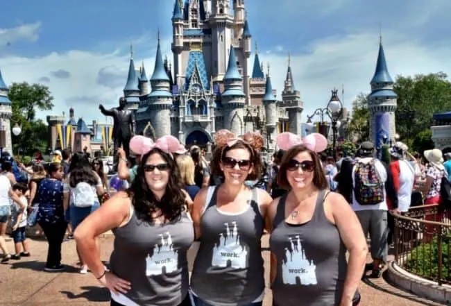 girls wearing Mickey ears headbands in front of the castle at Disney World