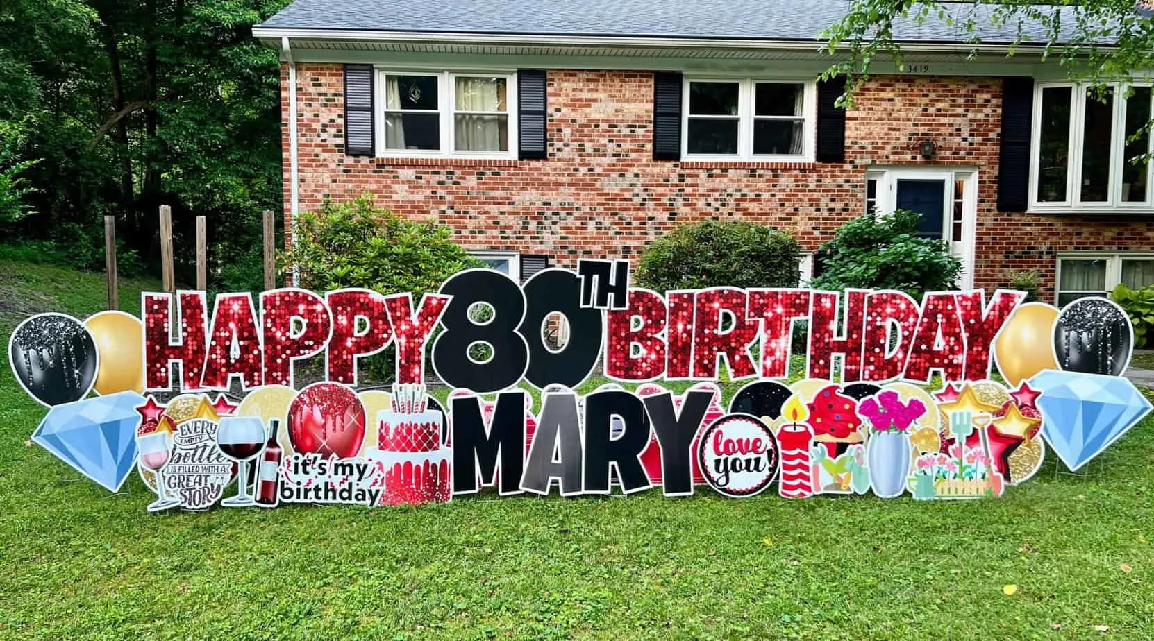 how to start your yard card business. Happy 80th Birthday in red and black sign set up in front yard. 