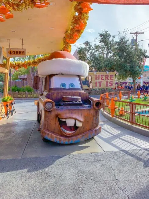 Disneyland at Christmas: Mater wearing a santa hat.