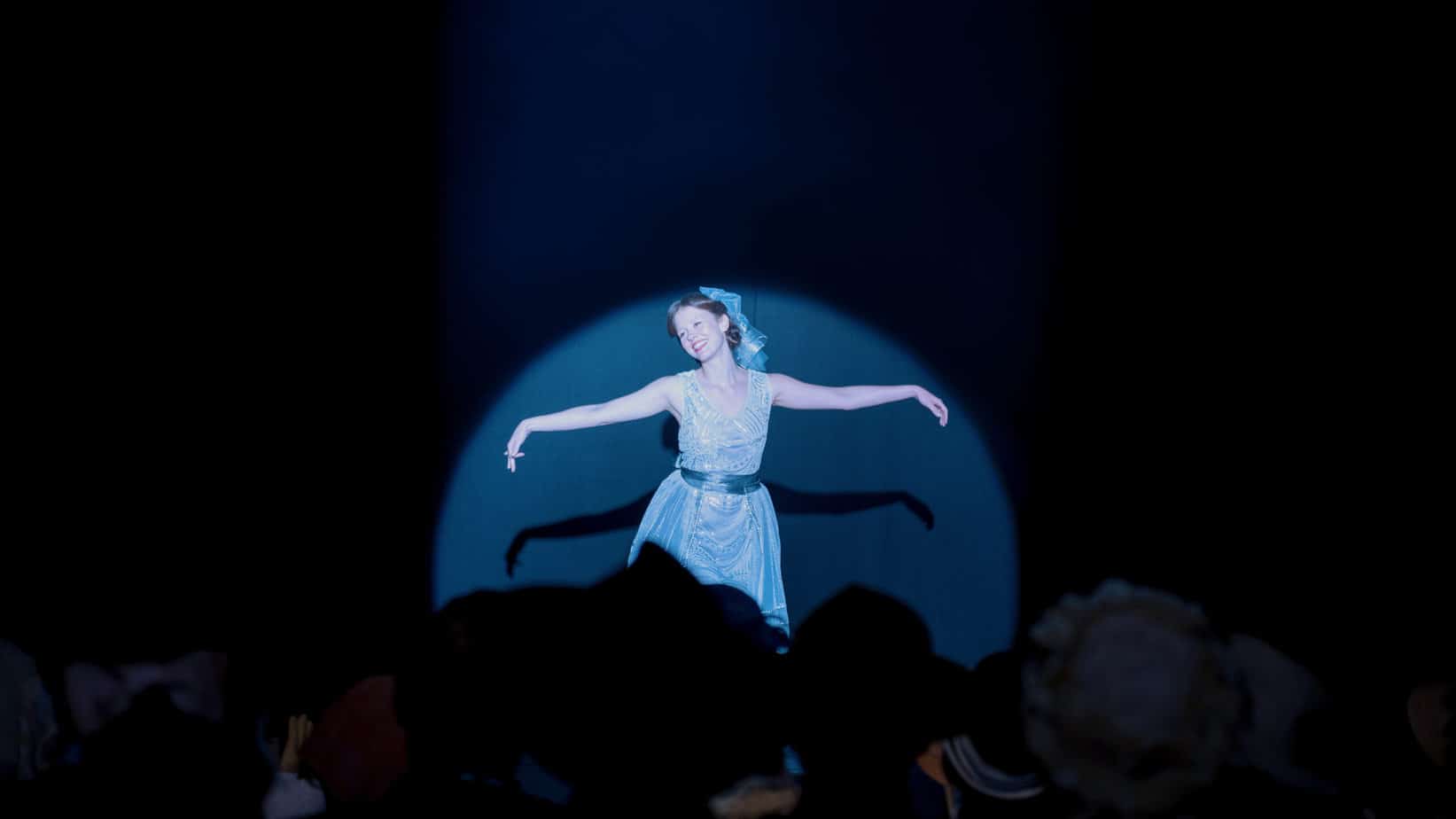 lines of dialogue and quotes from Pearl. Girl dancing in the spotlight on a black stage. 