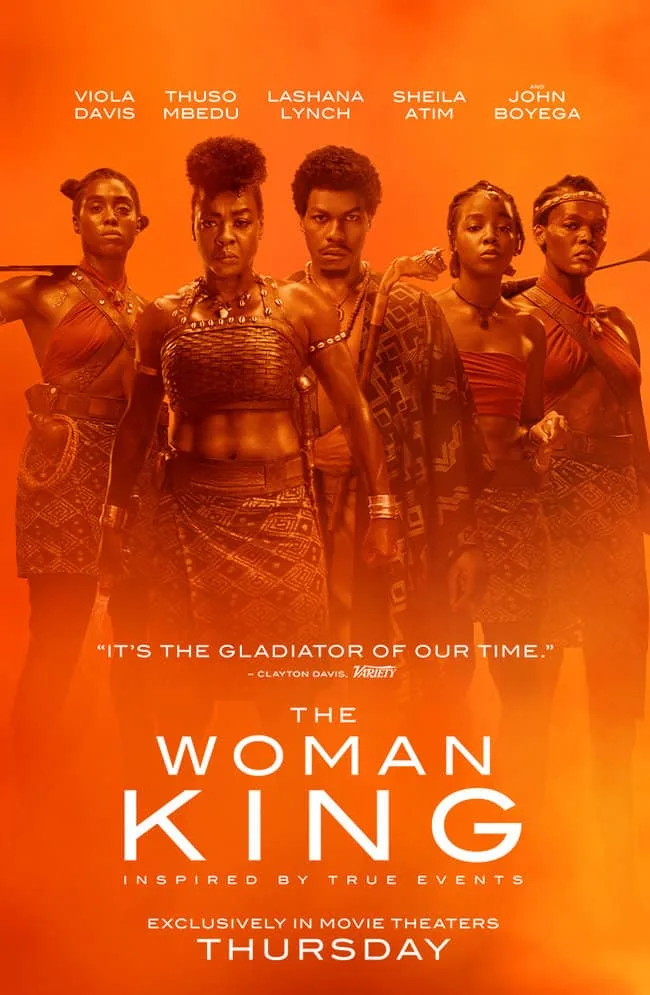 Quotes From The Woman King. Movie poster with 5 black warriors standing together with an orange background.
