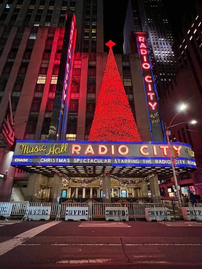 best new york christmas movies. Radio City Hall christmas tree at Christmas 